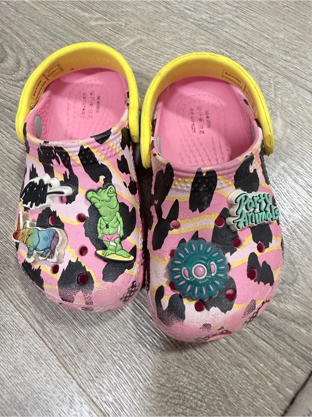 CROCS Kids Pink Leopard Print Clogs with Yellow Strap and Charms